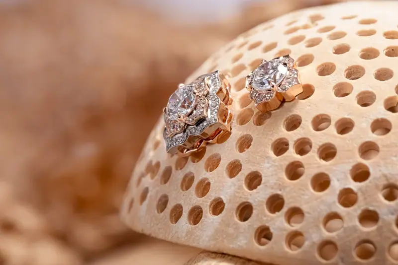 Two rings resting on a piece of pale coral