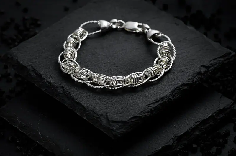 Silver chain bracelet on black slate